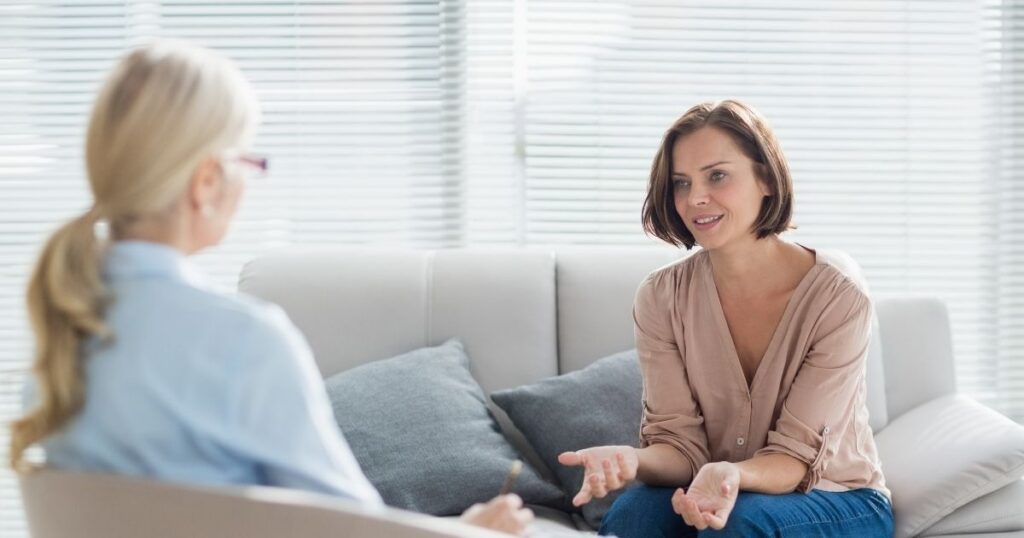 Patient consulting with a doctor during a medical appointment in a bright clinic.